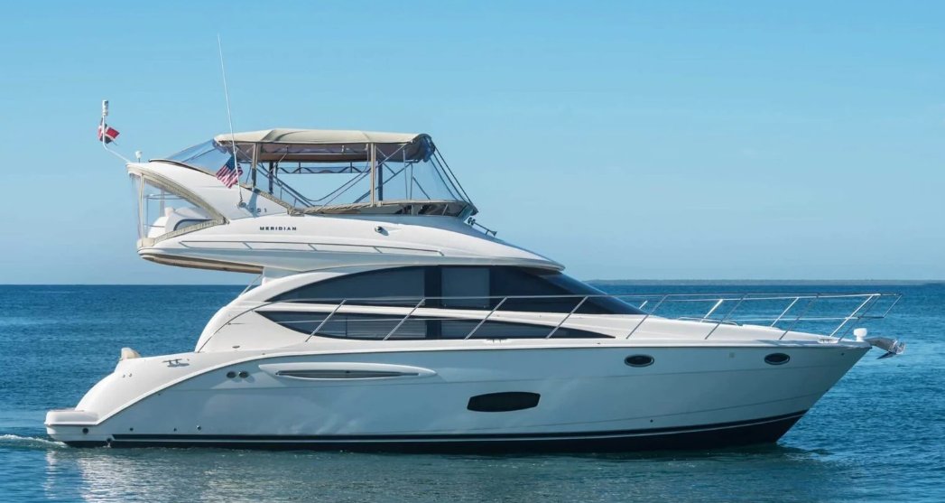 A two-deck yacht under way on a calm sea