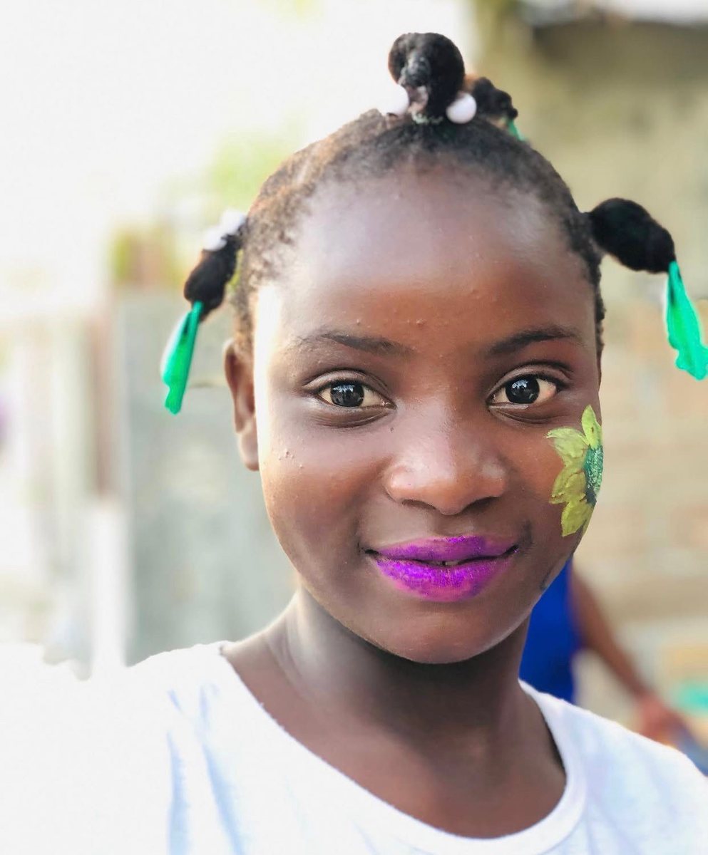 Portrait of a girl with her face painted for a party