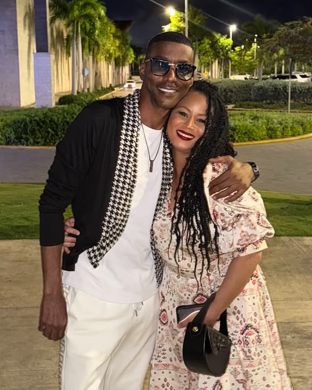 Rayma and Miguel A. Núñez Jr., arm in arm, at night in Punta Cana.
