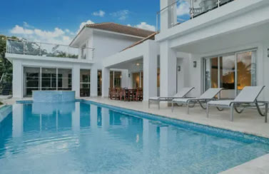 The rear façade of the main villa with its pool