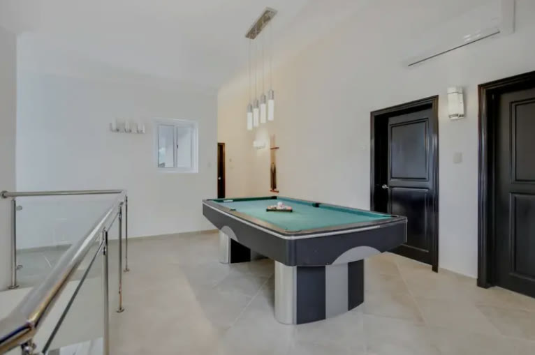 A room with a pool table