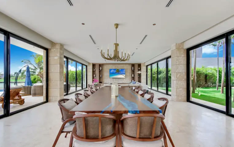 A fourteen-seat dining room with a water view