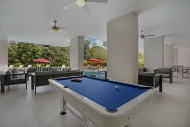 A pool table on the covered terrace