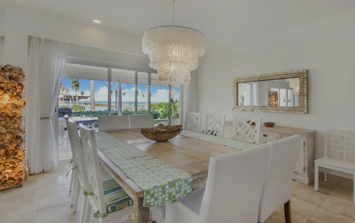 A dining room with a glass chandelier