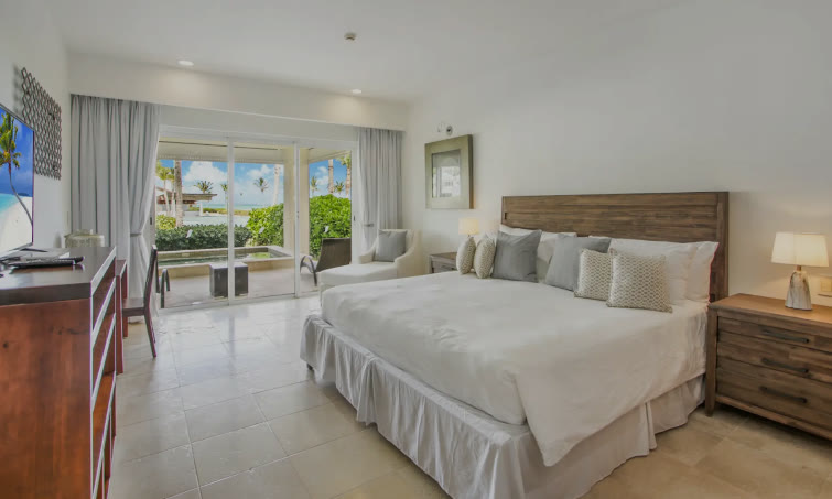 The main bedroom with a king bed and an ocean view