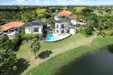 The villa from the air, facing the golf course lake